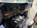 Interior view of a 2020 Chevrolet Express showing the dashboard controls including radio knobs and various buttons for vehicle functions