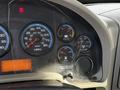 Dashboard of a 2012 International DuraStar 4300 showing speedometer voltage gauge fuel gauge and warning lights