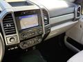 Dashboard and center console of a 2021 Ford F-250 SD featuring a touchscreen display and various controls for climate and audio settings