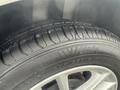 A close-up of a tire from a 2018 Ford Focus showcasing the tread pattern and brand name on the sidewall