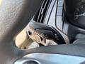 Close-up of the turn signal and headlight control lever inside a 2016 Ford Transit 150