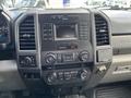 The interior dashboard of a 2017 Ford F-250 SD featuring various control buttons a touchscreen display and ventilation vents