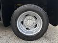 A close-up of a silver wheel with a five-bolt pattern and a black tire labeled ContiTrac TRD 275/70 R18 mounted on a 2017 Ford F-550