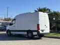 A white 2021 Mercedes-Benz Sprinter 2500 van parked with a high roof and rear doors closed