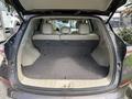 The interior of a 2016 Nissan Murano's cargo area is shown with empty seats folded down revealing a spacious storage compartment