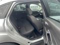 Interior view of a 2018 Ford Focus showing the rear seating area with black fabric seats and door panel details