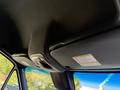 Interior view of a 2023 Mercedes-Benz Sprinter 2500 showing the ceiling area with a light fixture and safety labels