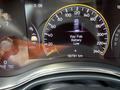 A 2015 Jeep Grand Cherokee dashboard display showing the speedometer and a warning for low key fob battery