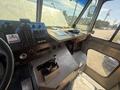 Interior view of a 2009 Workhorse W62 showing the dashboard controls and workspace with various instruments and switches