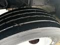 Close-up of a worn tire on a 2018 Ford E-450 showing visible tread wear and grooves