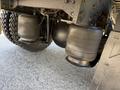 Two air suspension bags under a 2009 International 3000 CE bus showing detail of the components attached to the chassis