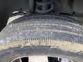 The image shows a close-up of a dirt-covered tire with noticeable tread patterns and wear on a 2009 Dodge Ram 5500