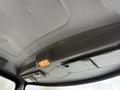 Interior view of a 2016 Peterbilt 348 truck cab showing the ceiling and overhead storage area with a light fixture