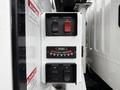 Control panel with switches for box dump and selector on a Freightliner M2 106 truck