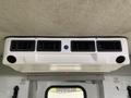 Interior air conditioning unit with several vents and controls visible on the ceiling of a 2015 Chevrolet Express van