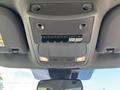 Interior ceiling controls of a 2022 Ford F-350 SD featuring various switches and lights for functions like work lights and auxiliary controls