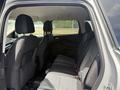 Interior view of a 2015 Ford Escape showing the rear seats with black fabric upholstery and seatbelts visible