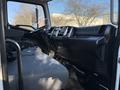 Interior view of a 2015 Hino 358 with a driver's seat steering wheel and dashboard showing controls and instruments