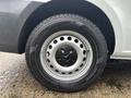Close-up of a 2021 Mercedes-Benz Metris wheel featuring a silver rim with circular holes and a black Hercules tire
