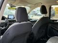 Interior view of a 2020 Ford Escape focusing on the front seats and dashboard with a digital display visible