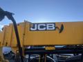 A yellow JCB 510-56 Loadall with a prominent JCB logo on its arm and various mechanical parts visible in the foreground