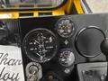 Dashboard of a 2004 Bombardier SW48 showing various gauges including fuel voltage temperature and other indicators