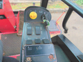 Control panel of a 2013 Toro Grounds Master 5910 featuring various buttons switches and a joystick for operating the mower