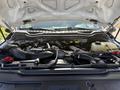 The image shows the engine compartment of a 2019 Ford F-550 with various components including the engine block air intake and cooling systems visible