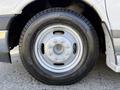 Close-up of a wheel and tire of a 2017 Chevrolet Express showing silver rim and black tire tread