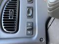 Close-up of control panel features in a 2006 Freightliner M2 106 including speed control and cruise control buttons
