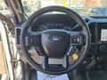 Steering wheel of a 2019 Ford F-550 with control buttons and a Ford logo at the center