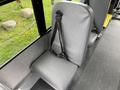 A gray seat with a safety strap suitable for passengers in a 2013 Chevrolet Express