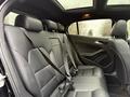 Interior view of the backseat of a 2016 Mercedes-Benz GLA-250 featuring black leather upholstery and three headrests