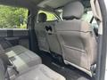 Interior view of the backseat of a 2017 Ford F-150 with two rows of fabric seats and seat belts visible
