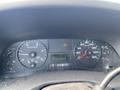 Dashboard of a 2007 Ford F-350 SD displaying speedometer tachometer and warning lights