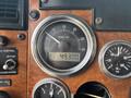 A close-up of the dashboard of a 2008 Peterbilt 340 showing the RPM gauge with a reading of 49300 and a pressure gauge for oil