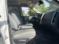 Interior of a 2014 RAM 5500 showcasing the driver's seat and dashboard with fabric seating and controls visible