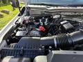 The engine compartment of a 2024 Ford F-550 featuring exposed components including the battery air intake and various wiring elements