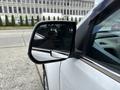 A side mirror of a 2017 Chevrolet Colorado reflecting the surroundings with a chrome trim and clear glass