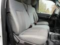 Front seats of a 2015 Ford F-450 with gray fabric covering and a textured pattern on the seat center