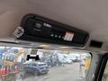 A control panel mounted overhead in a vehicle displaying buttons and indicators for an Altec system