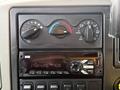 The image shows the dashboard controls of a 2016 International 7400 including climate control knobs and a radio with various buttons for tuning and volume adjustment