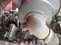 Close-up of a Toro Grounds Master 5910 engine component showing a black air intake with dirt and wear marks visible