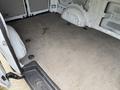 A 2019 Mercedes-Benz Metris cargo van with an empty interior featuring a gray carpeted floor and side panels