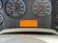 Dashboard of a 2011 International 4300 displaying gauges for RPM and speed along with a digital screen showing PRND421 and 1135.6 PTO hours