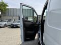 2023 Mercedes-Benz Sprinter van with an open driver's side door showcasing the interior dashboard and seating area