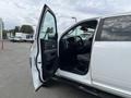 A 2015 RAM 2500 with the front driver's side door open showcasing the interior and dashboard