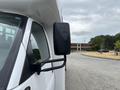 A 2020 Chevrolet Express with a side mirror mounted on the driver's side