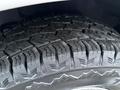 Close-up of a tread pattern on a tire from a 2016 GMC Savana showing deep grooves and rugged design suitable for off-road conditions
