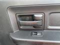 A close-up of a door handle on a 2013 RAM 5500 featuring a black plastic design with a rectangular shape and a lever-style mechanism